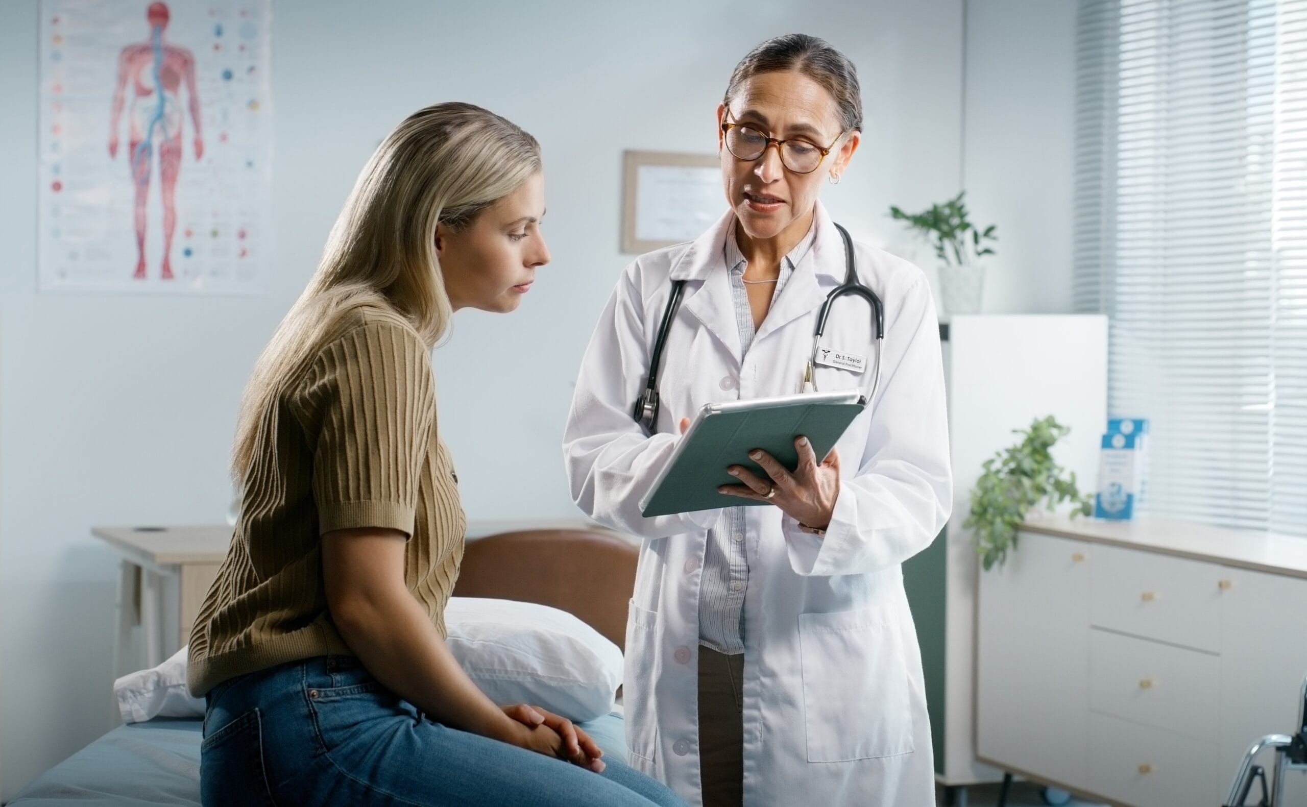 Doctor showing patient information on a tablet