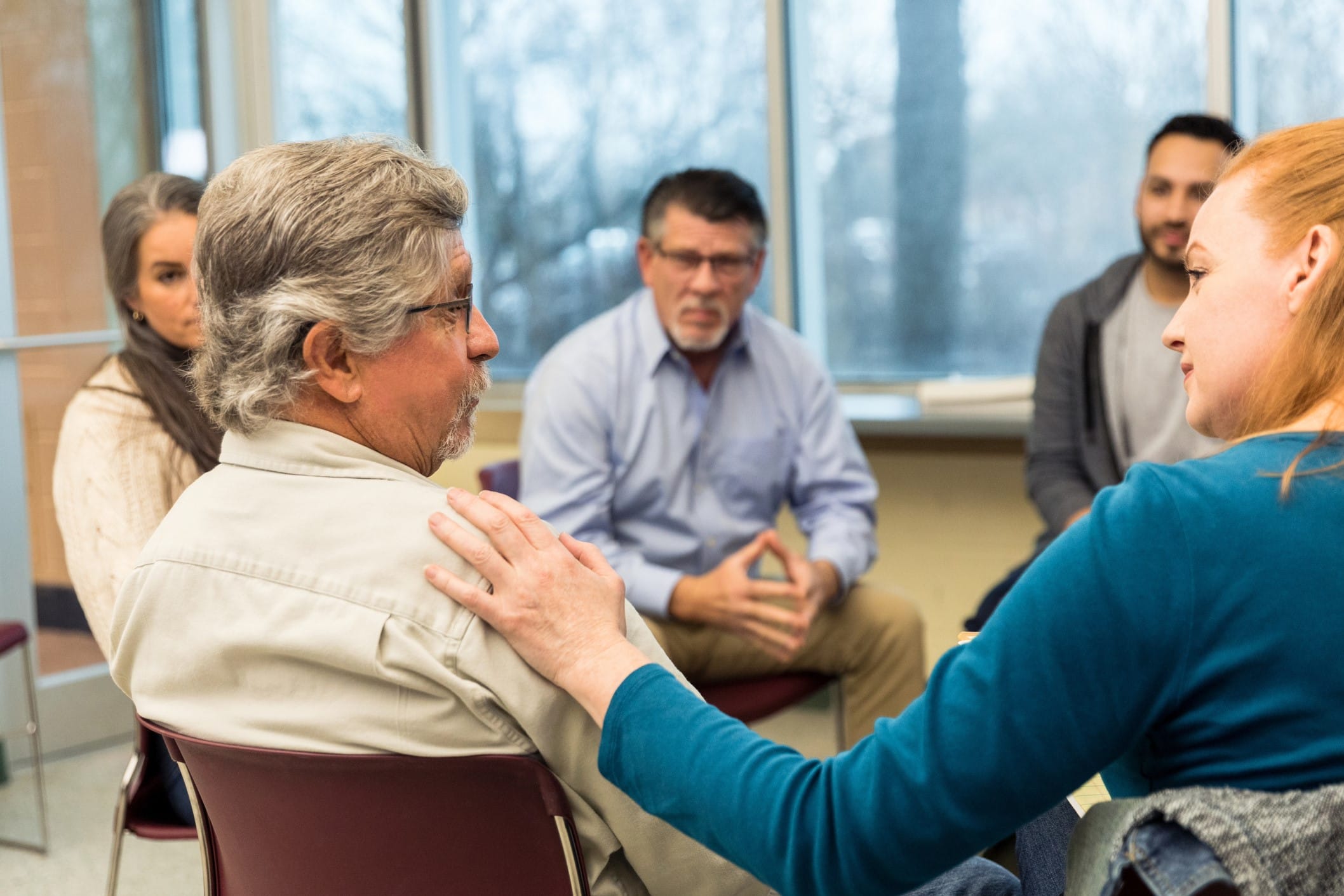 Support group sitting in a circle