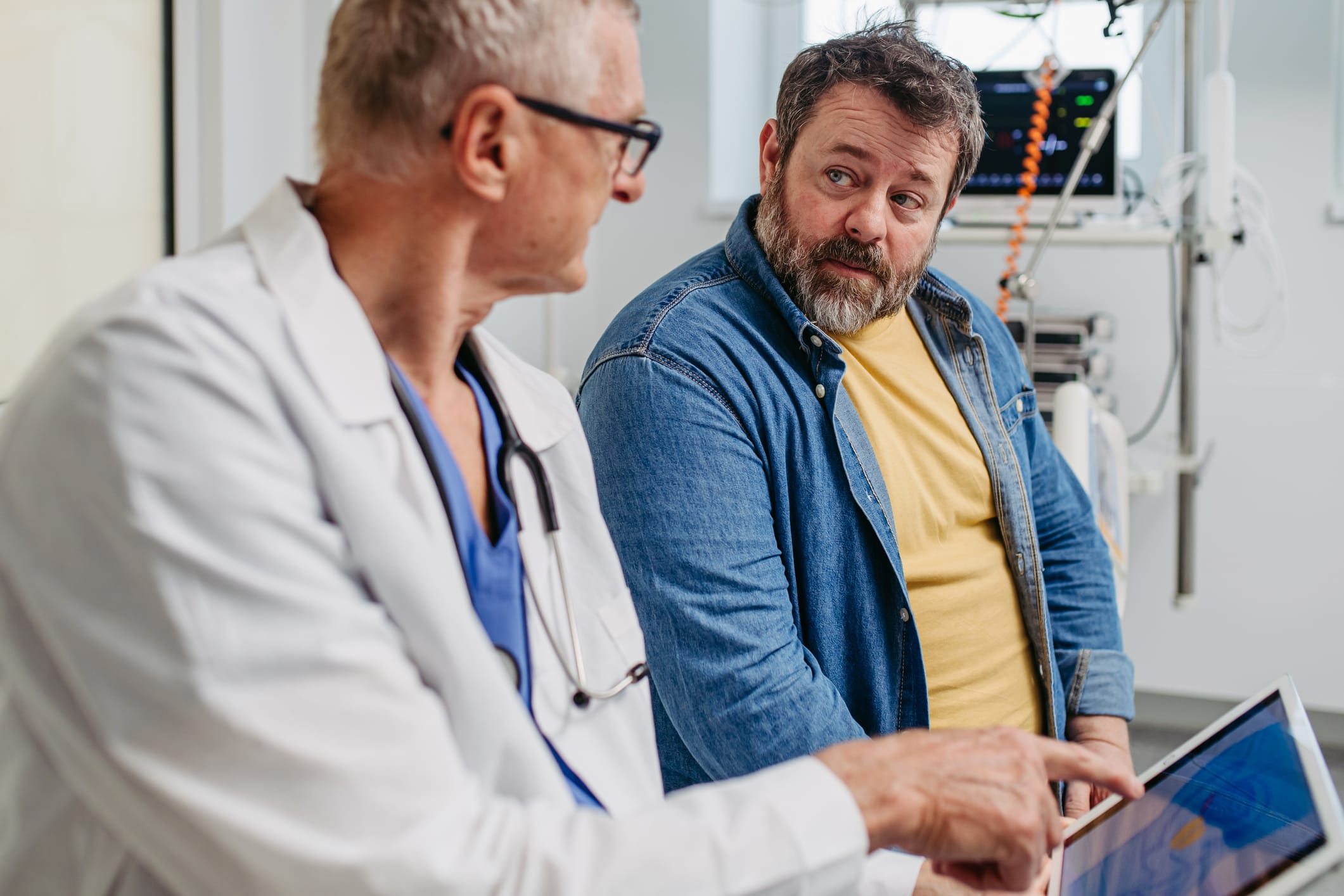 Doctor talking to a patient in office