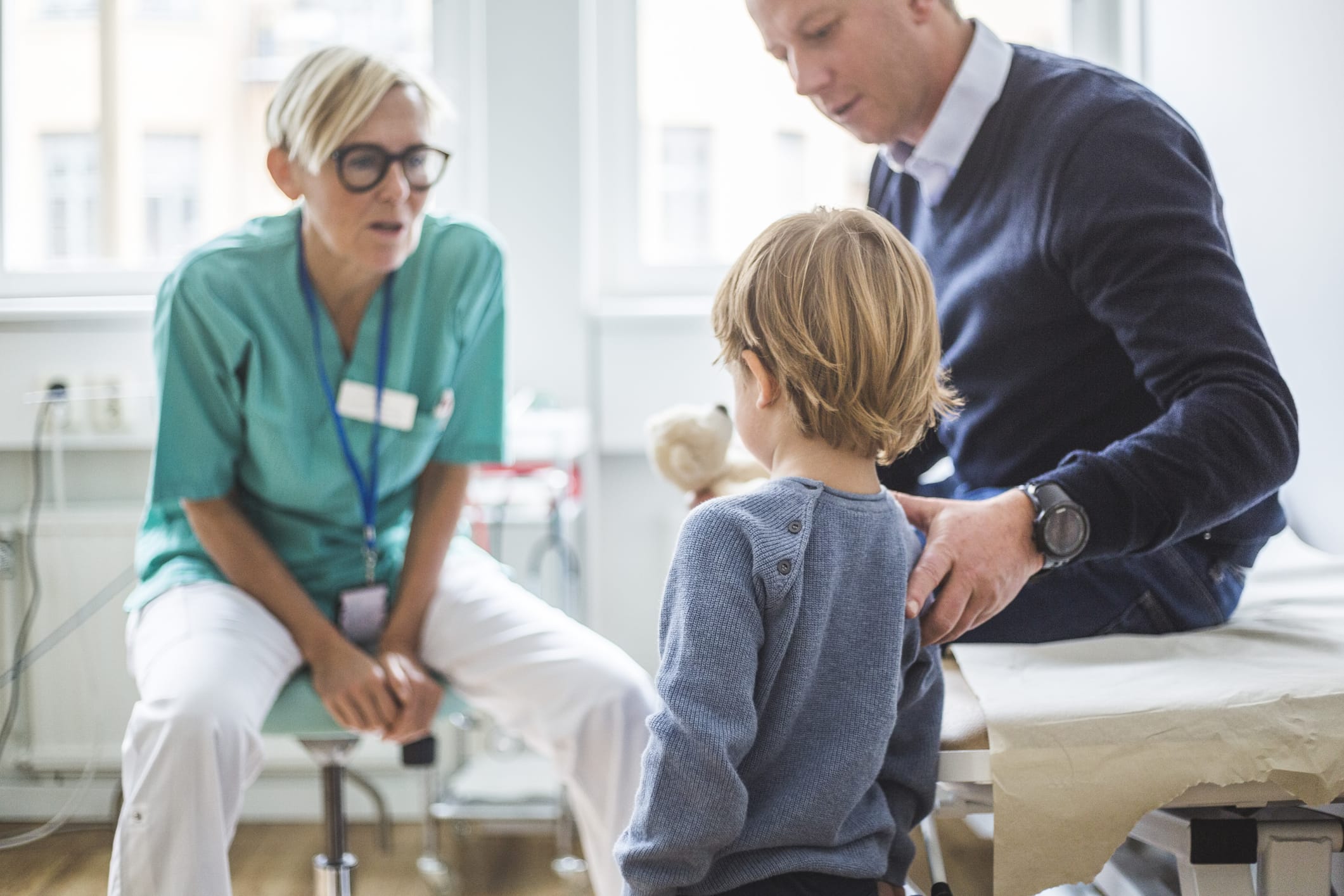Boy and father at a doctor's appointment