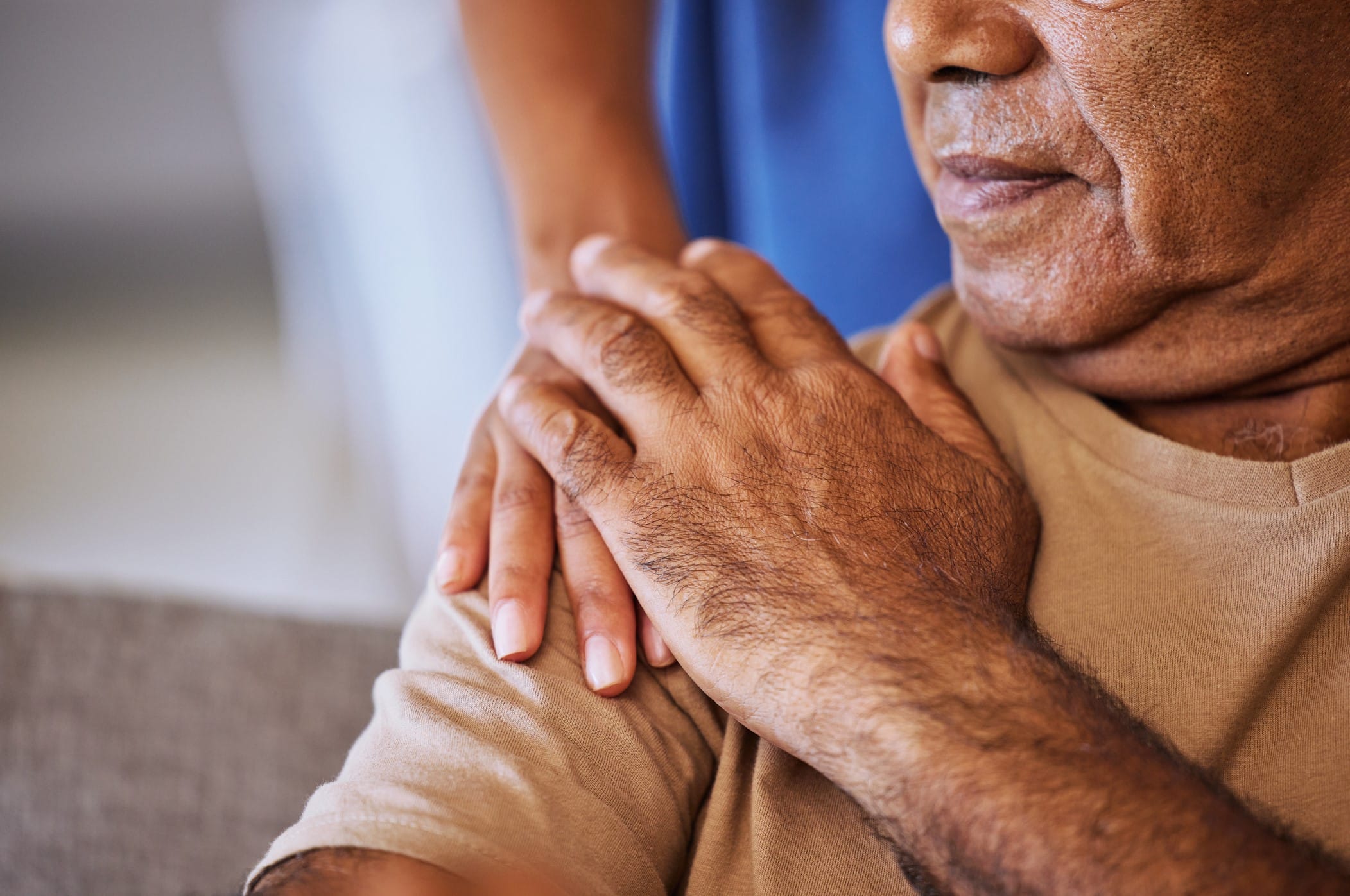 Hand on a patient's shoulder